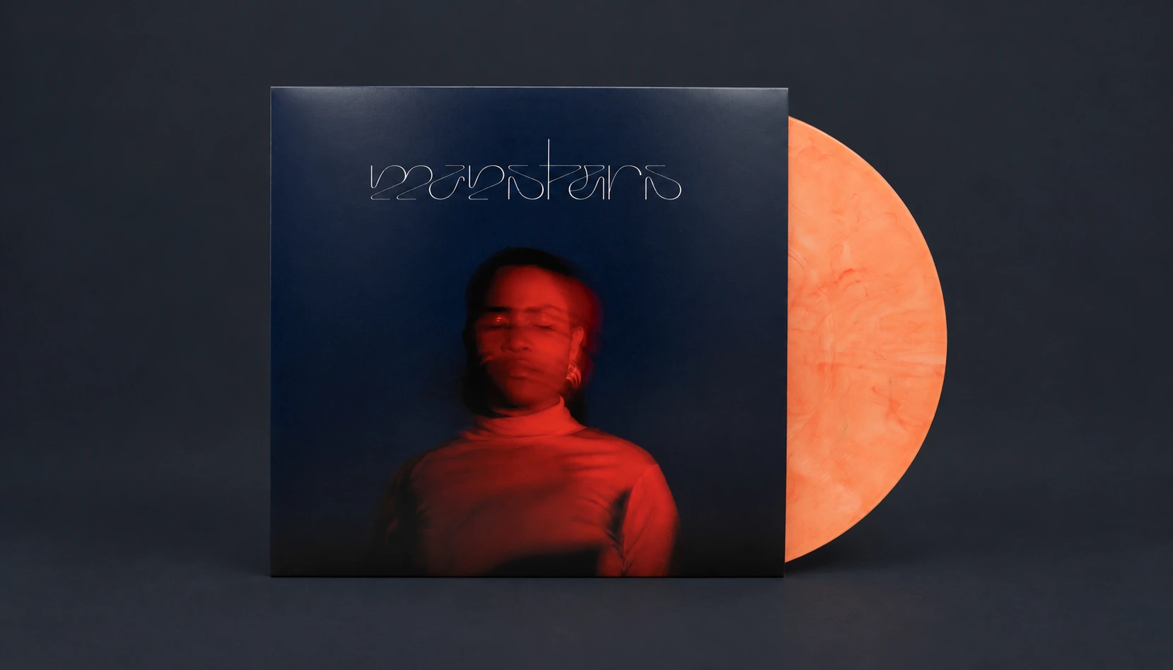 Monsters di Anna Bassy: copertina e vinile arancione su sfondo scuro